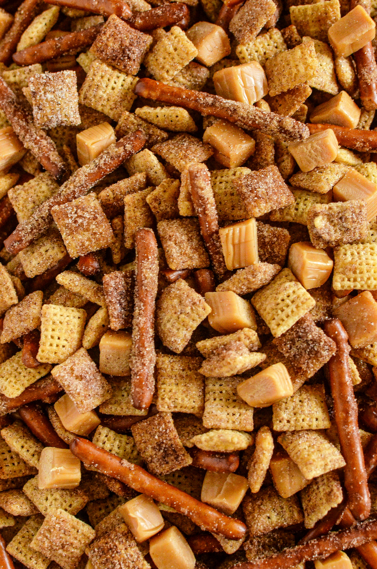 Cinnamon sugar Chex mix with pretzels and caramel squares.