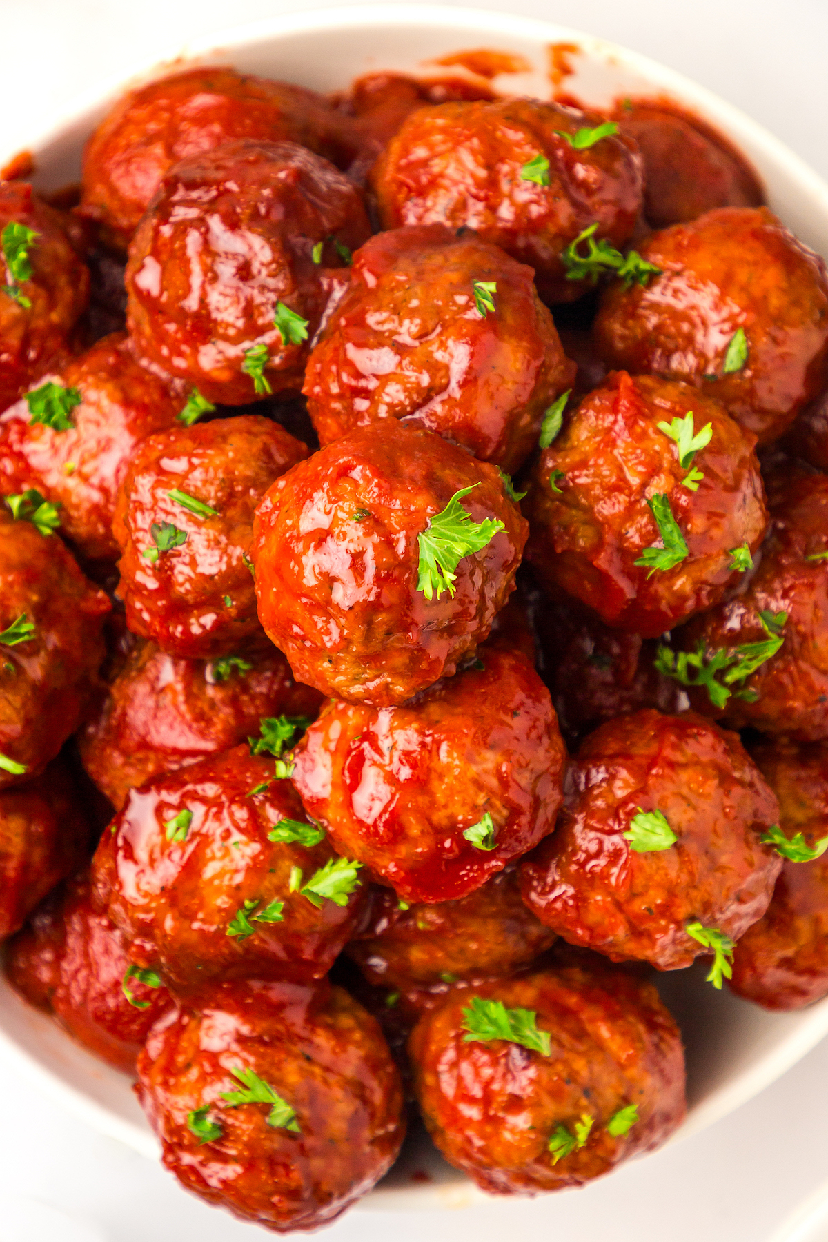 Overhead photo of meatballs in bbq sauce. 
