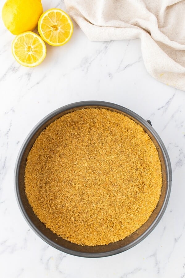 Graham cracker crust in a springform pan. 