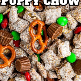 Christmas puppy chow with red and green m&ms, mini pretzels and Reese's cups.