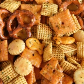 Chex mix recipe with ranch seasoning, multiple types of crackers and pretzels.