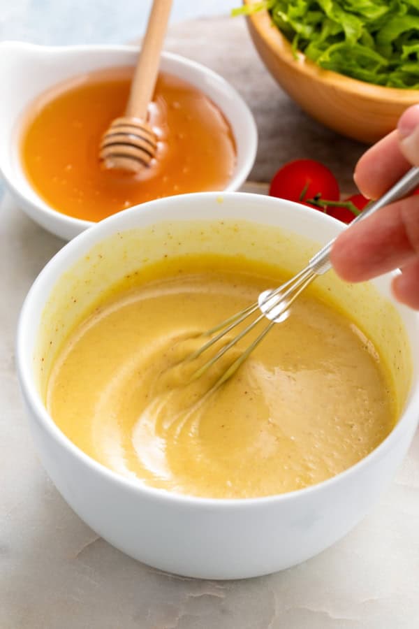 Ingredients are whisked in a bowl to create the best dipping sauce.