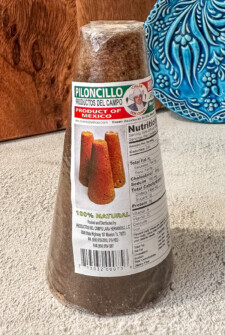 A wrapped Piloncillo cone with a brand label on it.