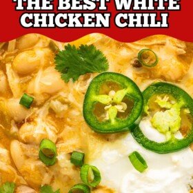 A bowl of creamy white chicken chili with sour cream on top.
