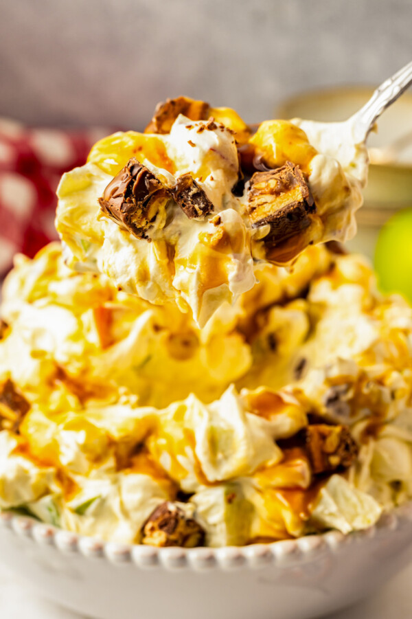 Spoonful of sweet and creamy, chilled Snickers salad.