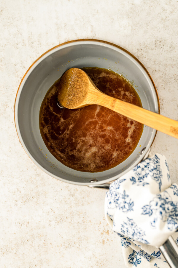 Making the caramel sauce in the pot. 