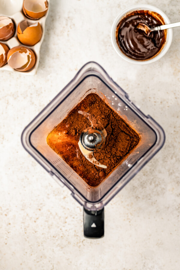 Blending the flan mixture until smooth in a blender.