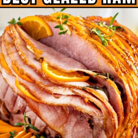 Garlic orange glazed ham on a serving platter.