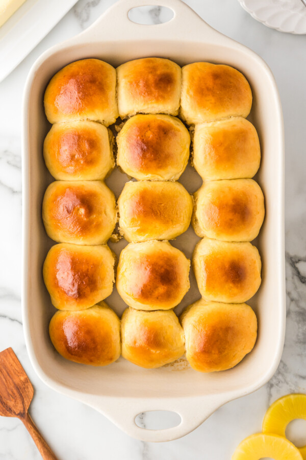 Baked soft yeast rolls in a baking dish.