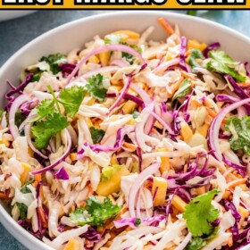 A bowl of fresh and creamy mango slaw with cilantro on top.