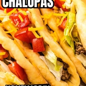 Copycat Taco Bell chalupa with beef filling topped with lettuce, tomatoes and shredded cheddar cheese.