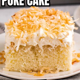 Coconut cake topped with cream of coconut, sweet coconut whipped cream and toasted coconut flakes.