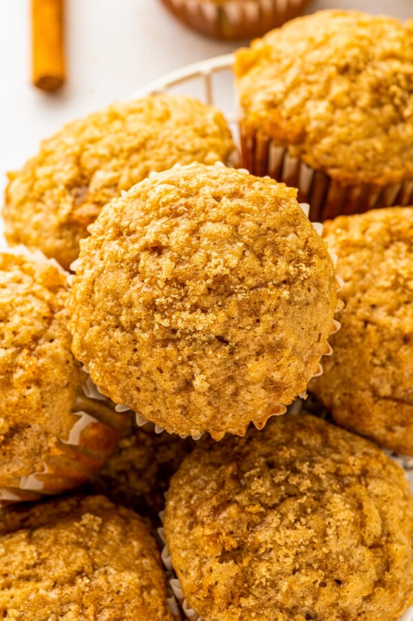 Warm and moist, these easy banana muffins arranged in a basket glisten with a sweet and crackly brown sugar topping.