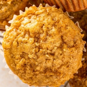 Moist brown sugar banana muffins arranged in a wire basket.