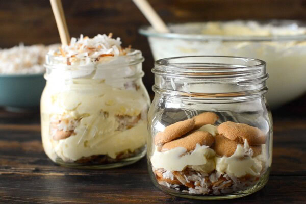 Vanilla wafer cookies laid on top of layers of creamy coconut pudding and toasted shredded coconut.