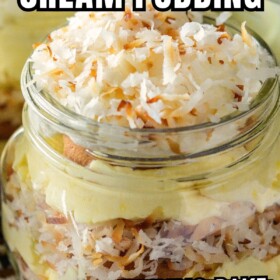 A mason jar with toasted coconut pudding with layers of vanilla wafers, shredded toasted coconut and creamy coconut pudding.