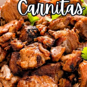 Juicy and crispy carnitas in a serving bowl with cilantro on top.