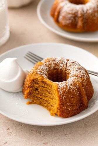 A bite has been taken out of a moist pumpkin bundt cake.