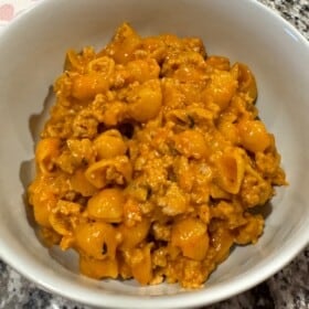 Bowl of homemade hamburger helper made with small shells and ground turkey.