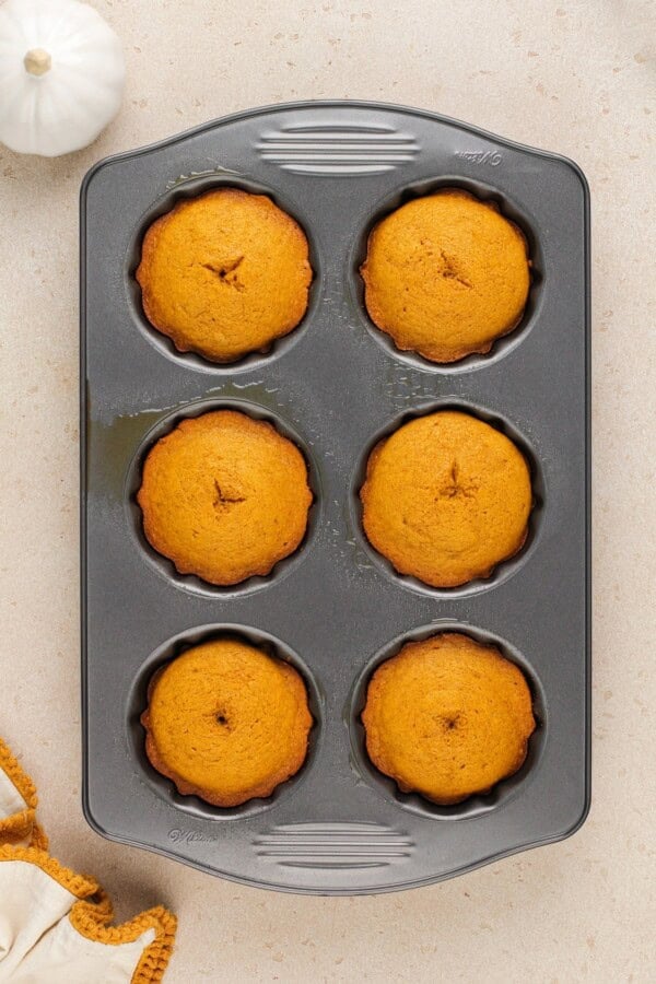 Baked mini bundt cakes in the baking pan.