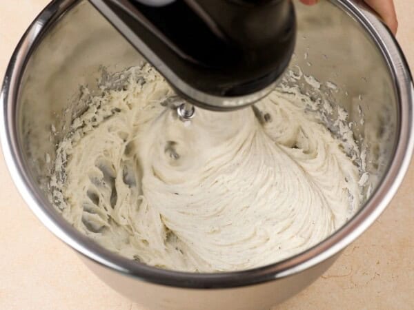 Frosting is whipped with a stand mixer.