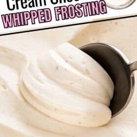 Sweet cream cheese frosting scooped with a spoon.