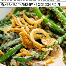 A wooden spoon scooping out a serving of green bean casserole with french's fried onions.