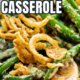 A wooden spoon scooping out a serving of the best green bean casserole with fresh green beans and homemade mushroom sauce.