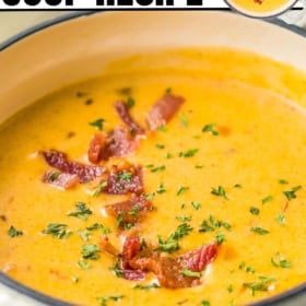 Crispy bacon on top of a pot of beer cheese soup.