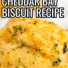 Homemade cheddar bay biscuit topped with butter.