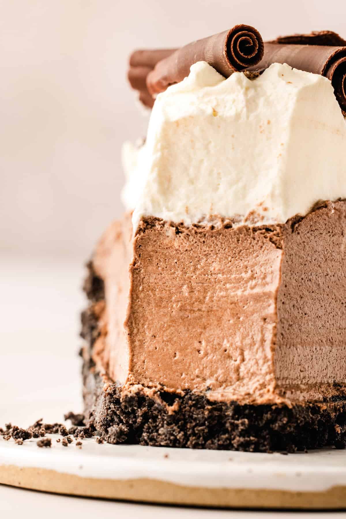 A single bite has been removed from a luscious slice of chocolate pie.