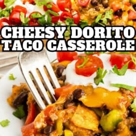 A close-up of a cheesy Dorito taco casserole topped with melted cheese, tomatoes, sour cream, and cilantro. Below, a fork holds a bite of the casserole, showing layers of beans, peppers, and Dorito chips.