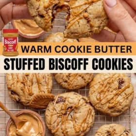 A hand breaks apart a warm, gooey stuffed Biscoff cookie drizzled with cookie butter. More cookies and a small bowl of Biscoff spread sit on a cooling rack nearby.