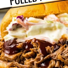 Close-up of an instant pot pulled pork sandwich topped with barbecue sauce and creamy coleslaw on a bun.