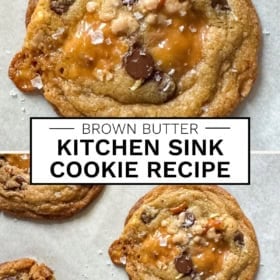 A close-up of brown butter kitchen sink cookies with pools of caramel, chocolate chips, pretzel pieces, and flaky sea salt on parchment paper.